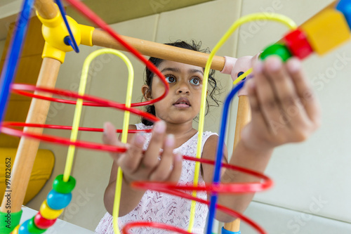 Little girl play with toy