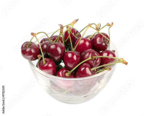 Sweet cherries in glass plate