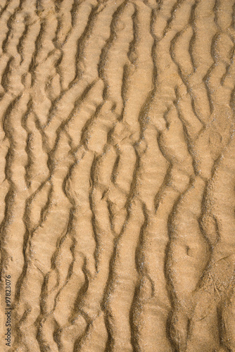 Beach sand full frame texture background natural shape vertical composition