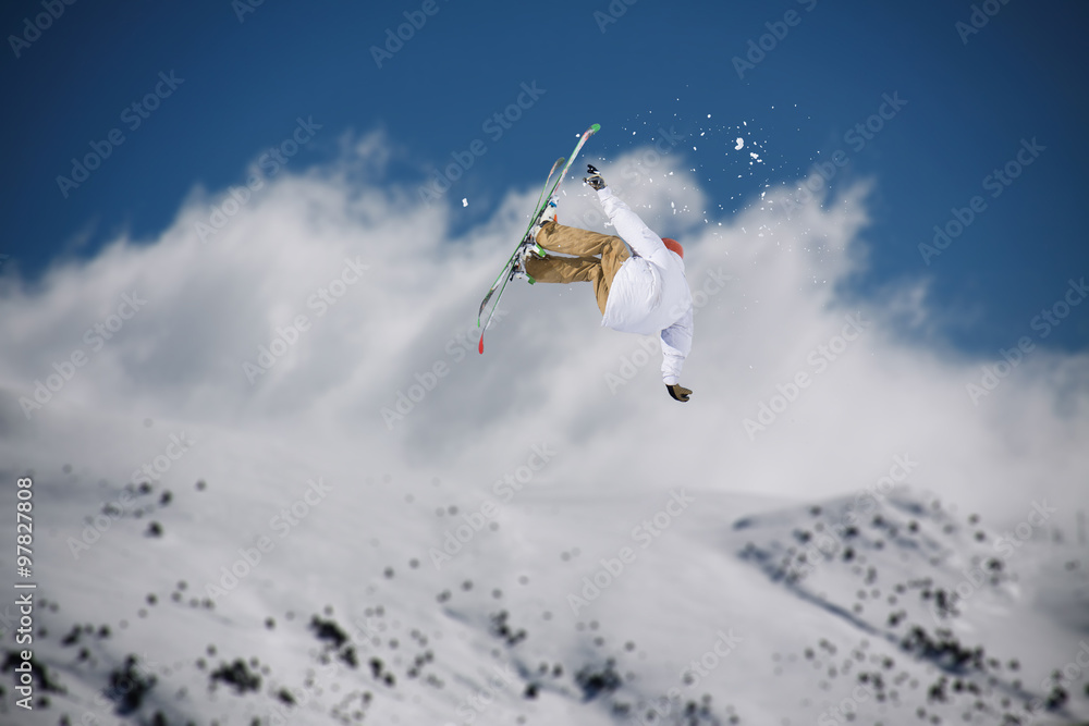 Flying skier on mountains. Extreme sport. Flying skier on mountains. Extreme sport.