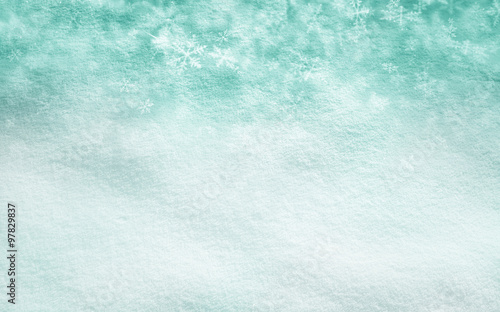Abstract snow texture background with green color snowflake background. Christmas and New Year Holidays snowy copy space background.
