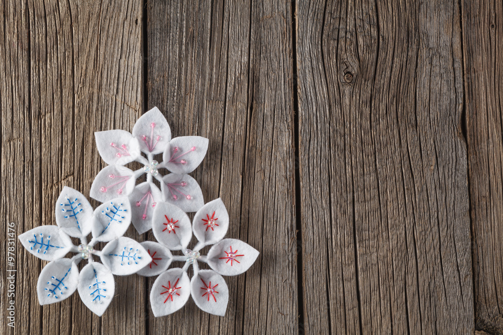 Felt decoration on rustic wooden background Felt decoration on rustic wooden background