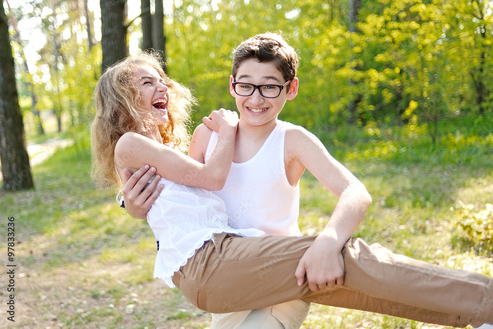 Fototapeta premium Portrait of a boy and girl in summer