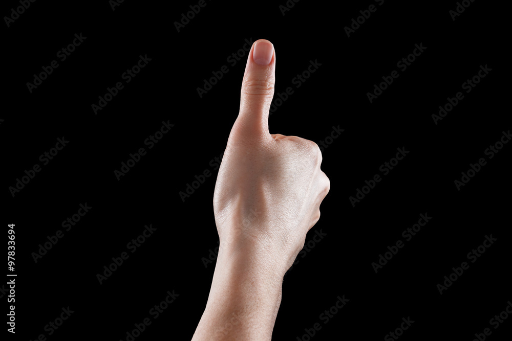 Approval thumbs up like sign as caucasian hand gesture isolated over black Approval thumbs up like sign as caucasian hand gesture isolated over black
