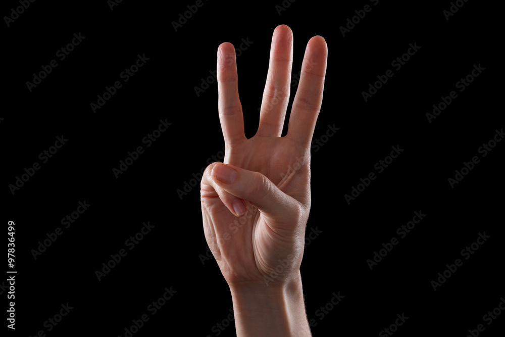 Female hand showing number three Female hand showing number three