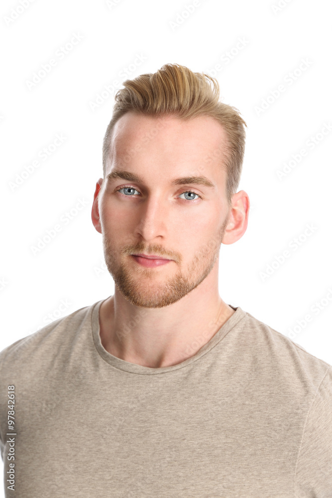 Fototapeta premium An attractive healthy man standing against a white background wearing a beige t-shirt.