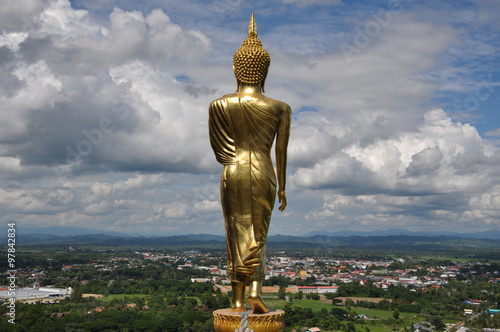 Stand gold buddha