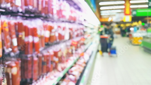 Wallpaper Mural Supermarket store motion people, blur background with bokeh Torontodigital.ca