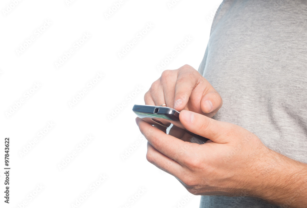 Young caucasian man in a gray t-shirt smartphone Young caucasian man in a gray t-shirt smartphone