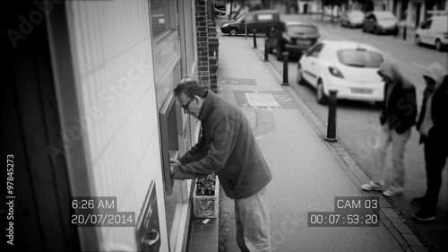  CCTV footage of suspicious males stealing from man at ATM machine