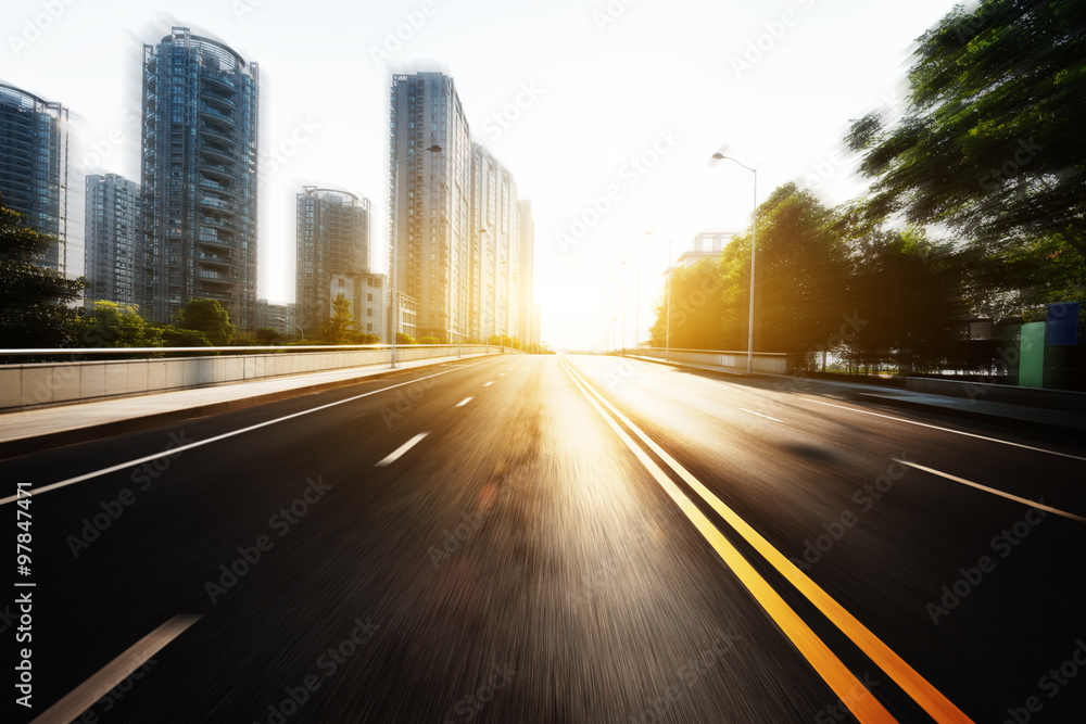 sunlight and empty asphalt road with traffic sign sunlight and empty asphalt road with traffic sign