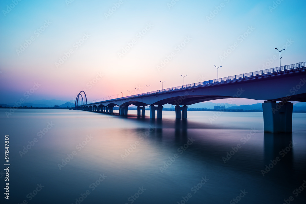 sunrise skyline and landscape of bridge over river sunrise skyline and landscape of bridge over river