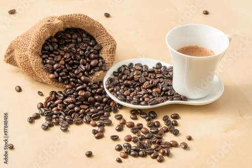 Cup of coffee and fresh roasted organic Coffee beans on isolated background, food and drink background