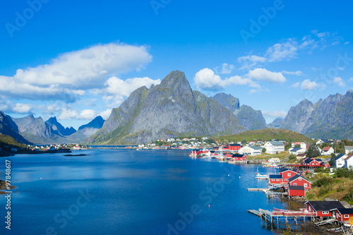 Beautiful super wide-angle summer aerial view of Reine, Norway, Lofoten Islands, with skyline, mountains, famous fishing village with red fishing cabins, Moskenesoya, Nordland photo
