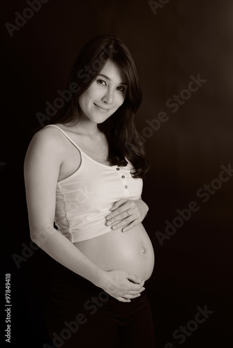 Portrait of the young happy smiling pregnant asian woman