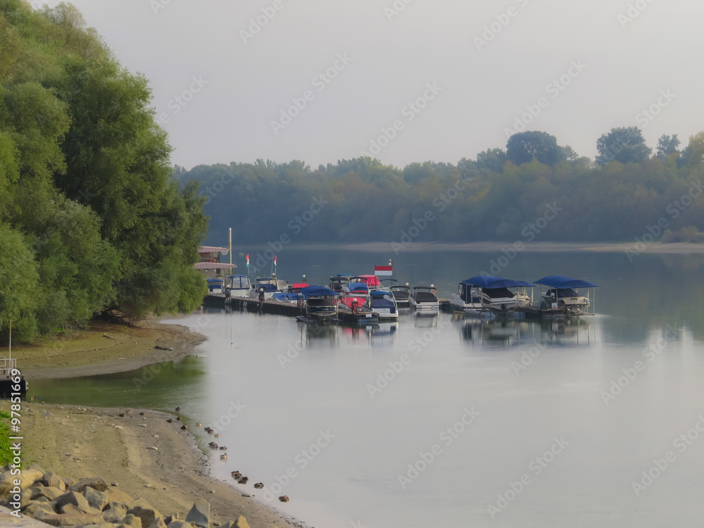 Boats on the Danube River at the foggy morning, Szentendre, Hungary