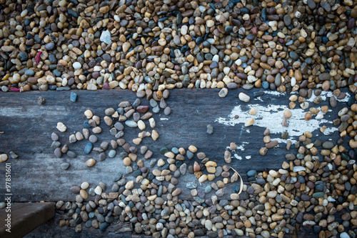 Wooden floorboards and stone gravel