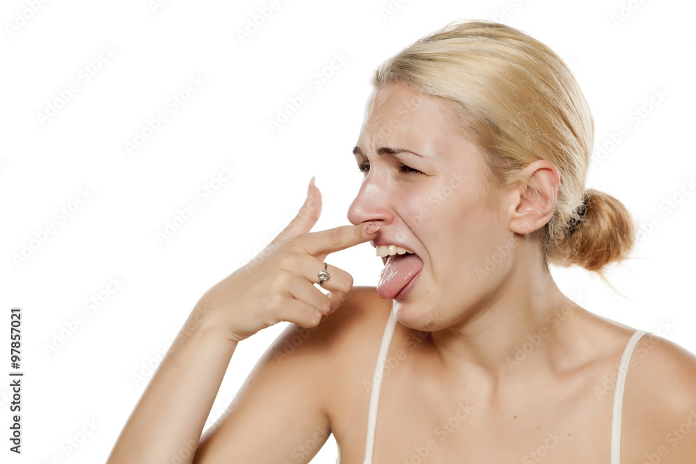 young blonde is squeamish because of the odor young blonde is squeamish because of the odor