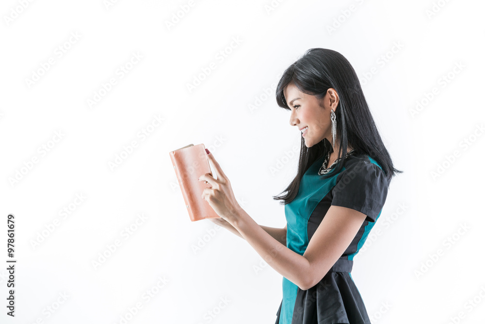 Woman wearing a green dress with documents in hand. Woman wearing a green dress with documents in hand.