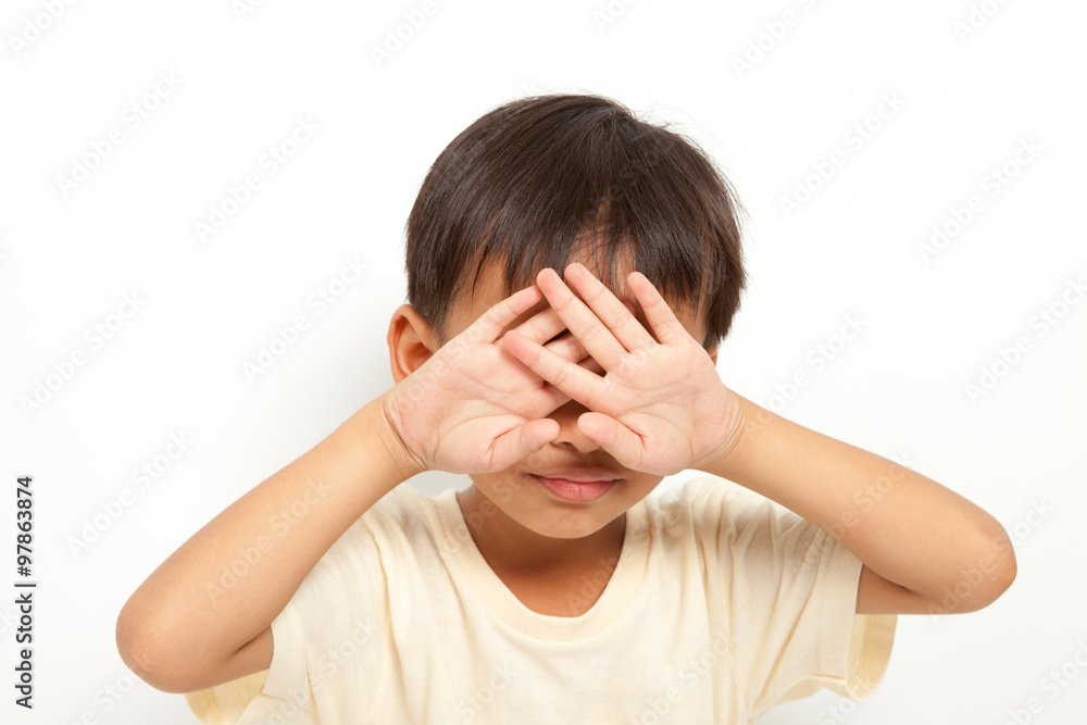 Child raising hands to protect itself crying ,solated on white background Child raising hands to protect itself crying ,solated on white background