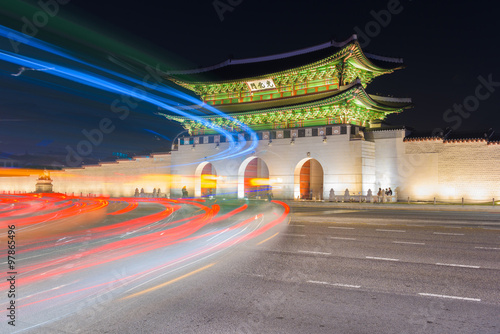 Traffic blurs past Gyeongbokgung palace at night in Seoul, South © CJ Nattanai