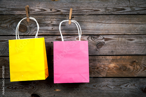 Shopping bags on a wooden background, sale, purchase