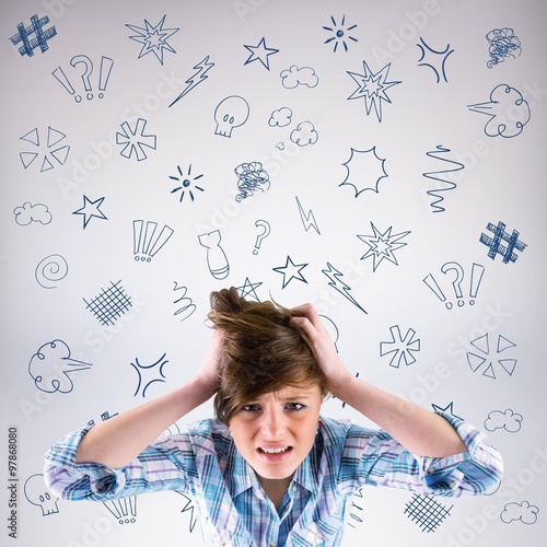 Brunette getting a headache with hands on head photo