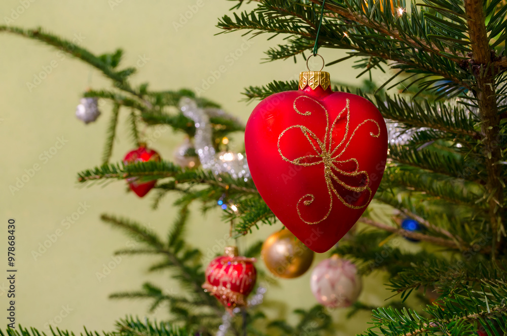 Fototapeta premium Beautiful colorful christmas decorations hanging on christmas tr