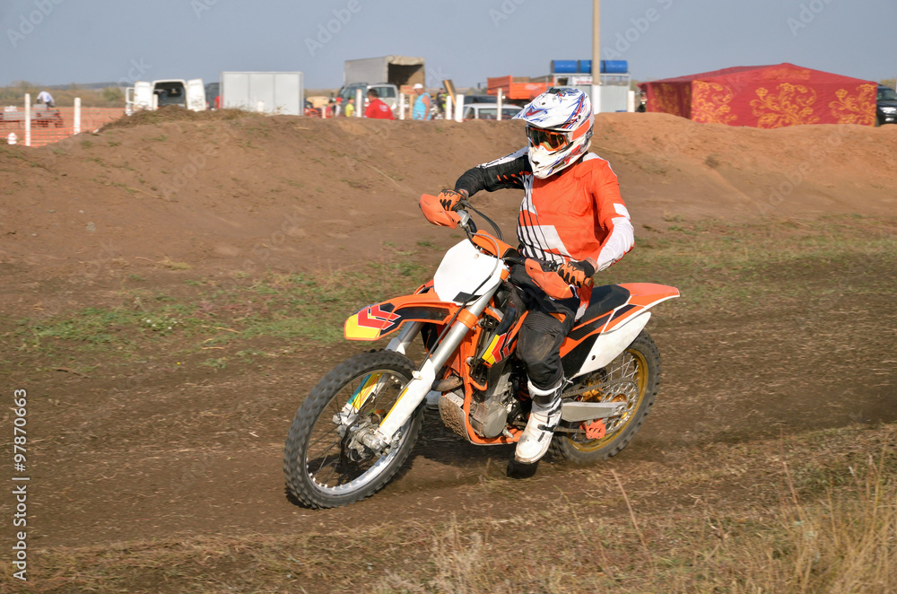 MX racer on a motorbike, acceleration out bend on track motocross MX racer on a motorbike, acceleration out bend on track motocross