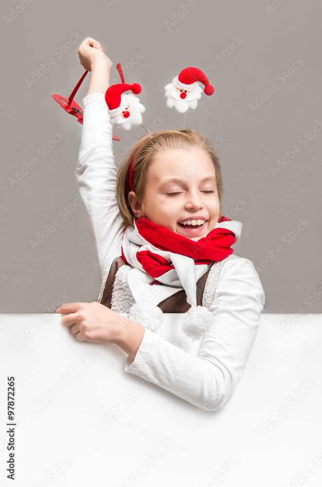 Happy little girl in the Christmas the symbols on the background Happy little girl in the Christmas the symbols on the background