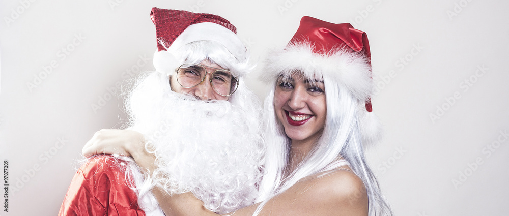 Female and male Santa Claus hugging and smiling letterbox Female and male Santa Claus hugging and smiling letterbox