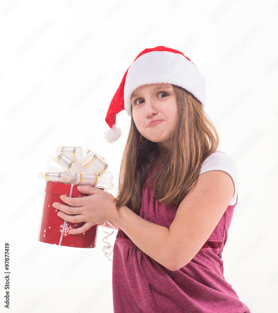 Girl teenager with a gift in a Santa hat Girl teenager with a gift in a Santa hat