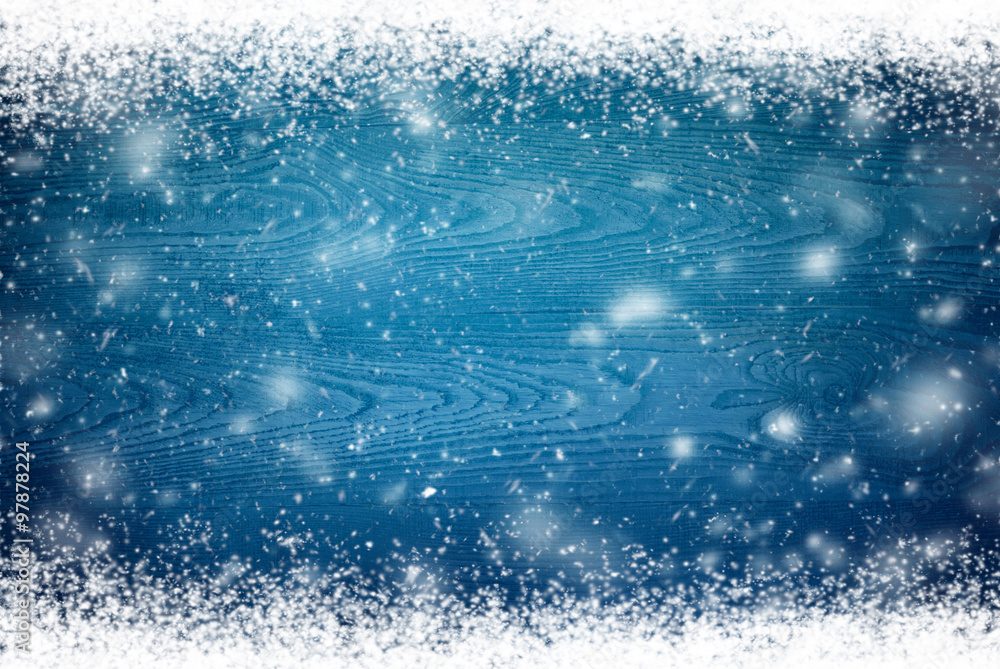 Winter background with flying snowflakes