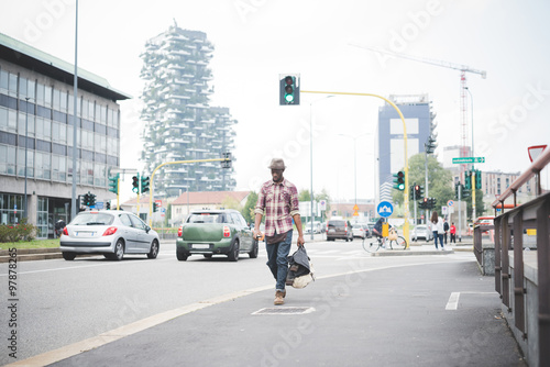  young handsome afro black man walking in the street of the city © Eugenio Marongiu