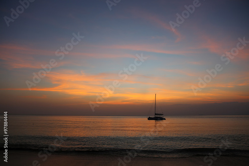 Amazing sunset view with catamaran on the sea. © Tarik GOK
