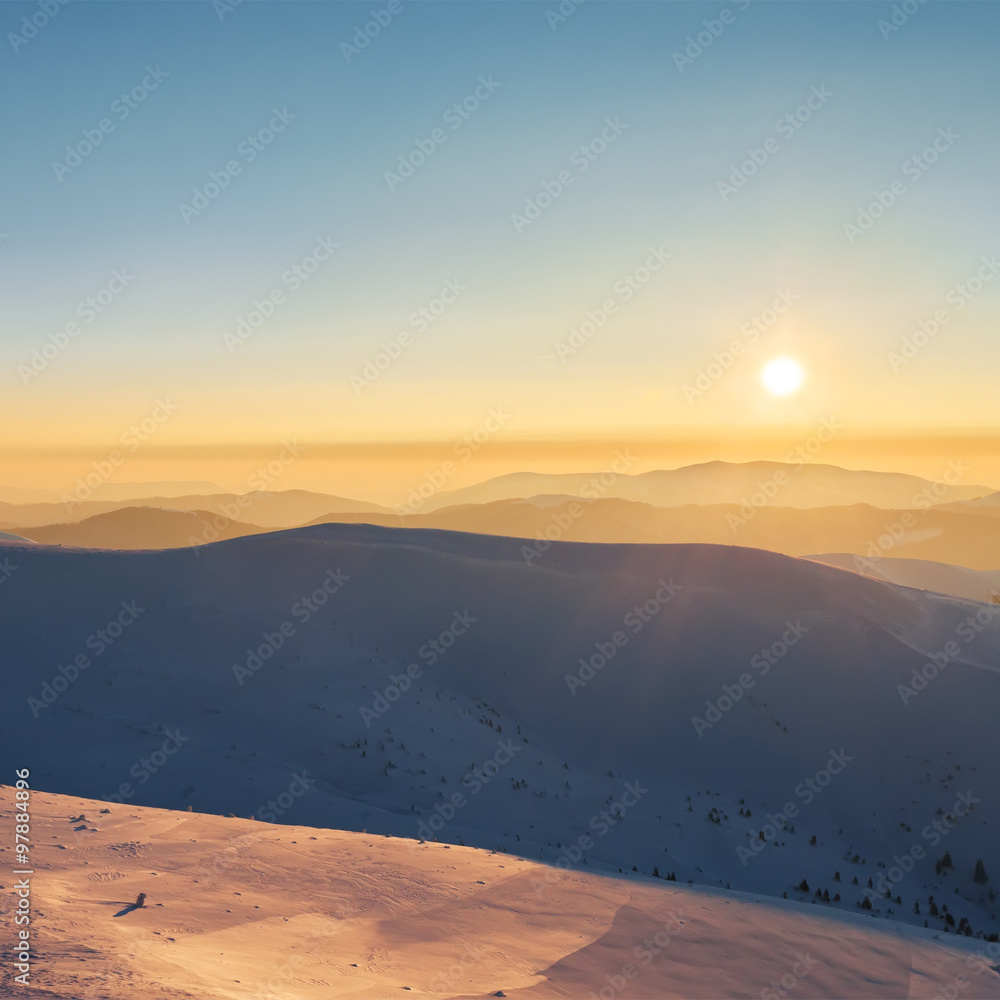 Beautiful  sunset in mountains. Winter landscape.