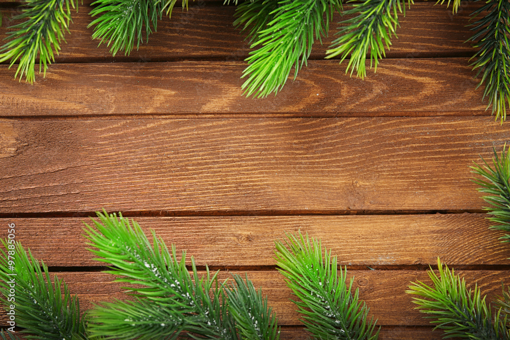 Christmas fir tree branches on wooden table Christmas fir tree branches on wooden table