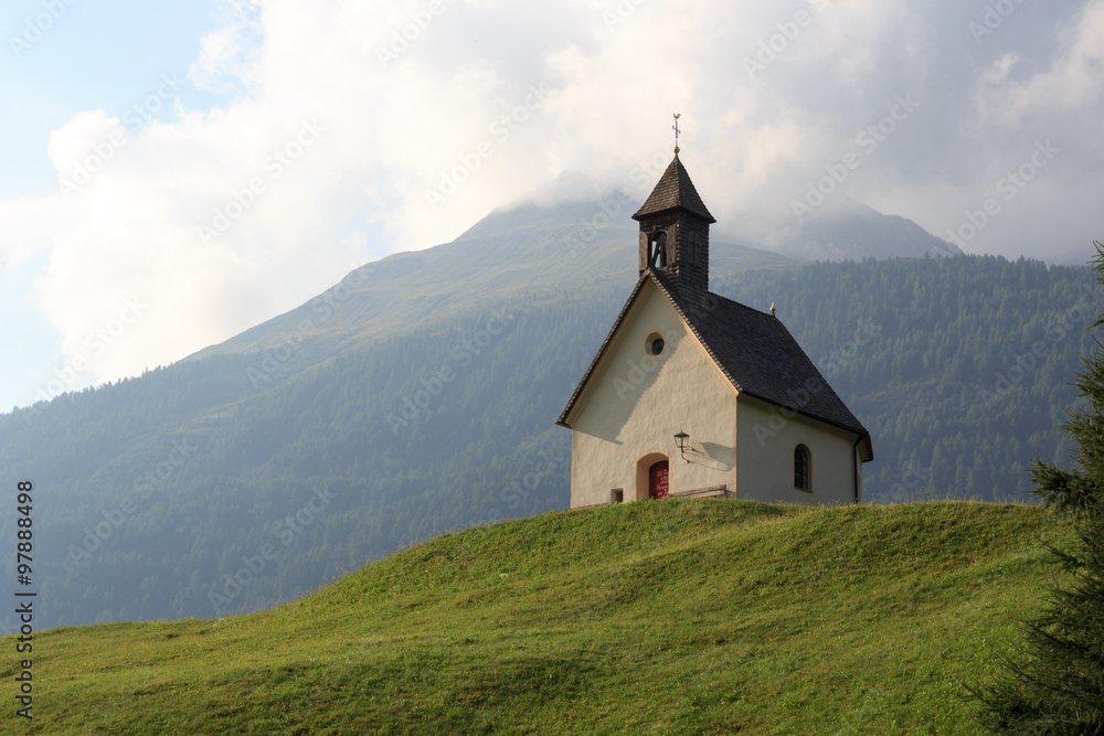 Holy spirit chapel in alpine village Bichl with mountain, Austria
