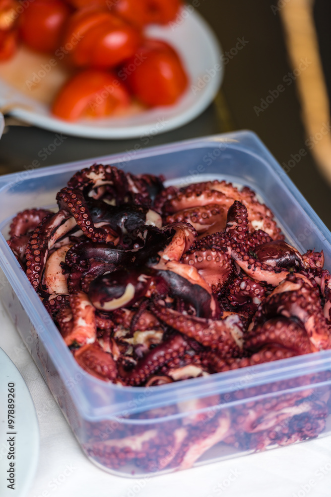 Cooked octopus parts in a box Cooked octopus parts in a box
