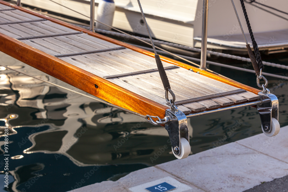 wooden ladder on marine yacht staying in port wooden ladder on marine yacht staying in port