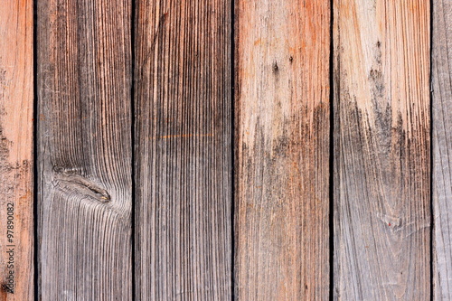  Teak wood texture background. Wooden door composed of vertical teak planks with tongue and groove joints. After years in exposed condition the planks shown interesting texture.