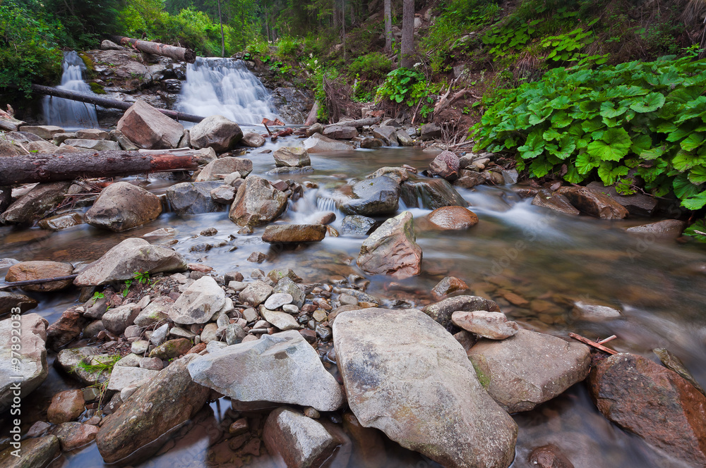 A small waterfall on the river in the Carpathians. Europe, Ukrai A small waterfall on the river in the Carpathians. Europe, Ukrai