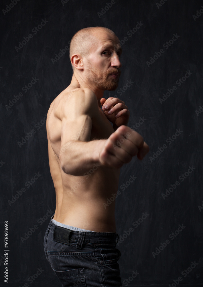 Aggressive young man with his fists