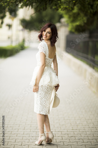 Young woman in white drress at outdoors