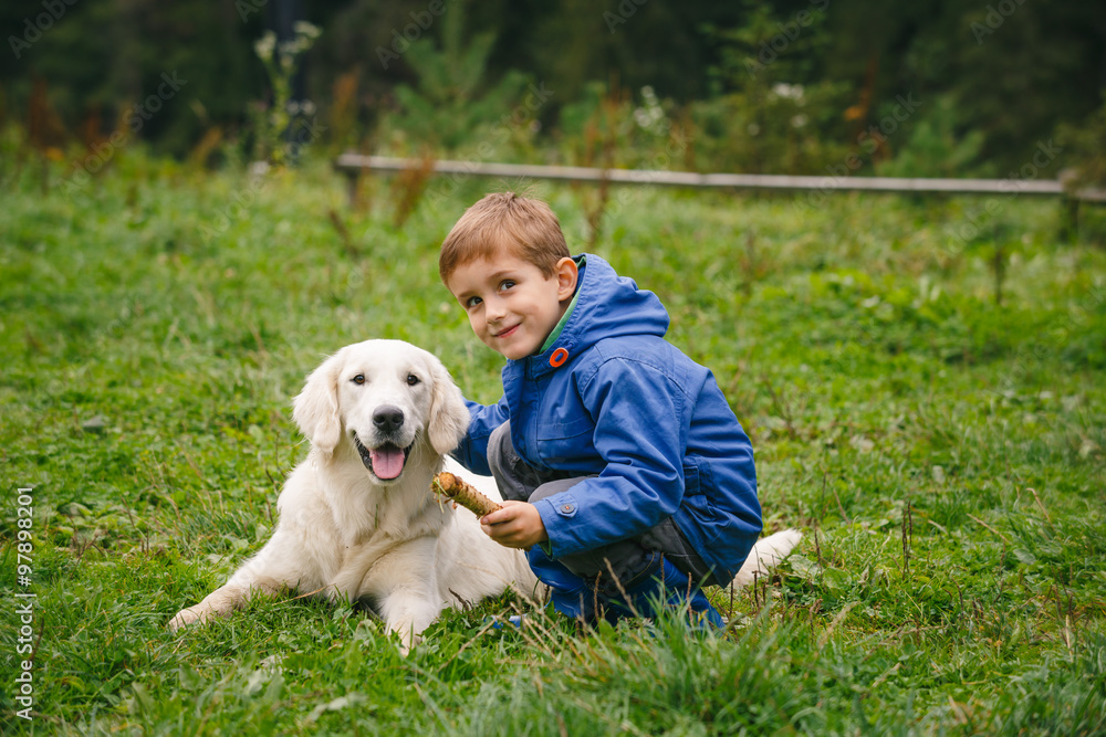 Boy with his pet in the forest Boy with his pet in the forest