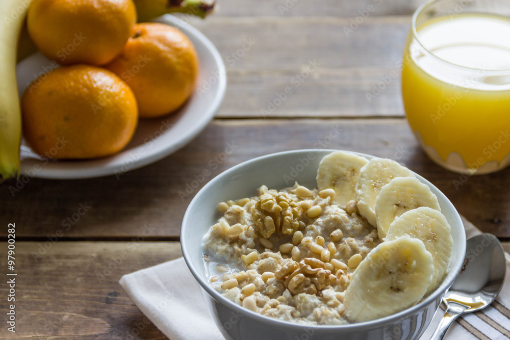 oatmeal with bananas and nuts and orange juice and fruit oatmeal with bananas and nuts and orange juice and fruit