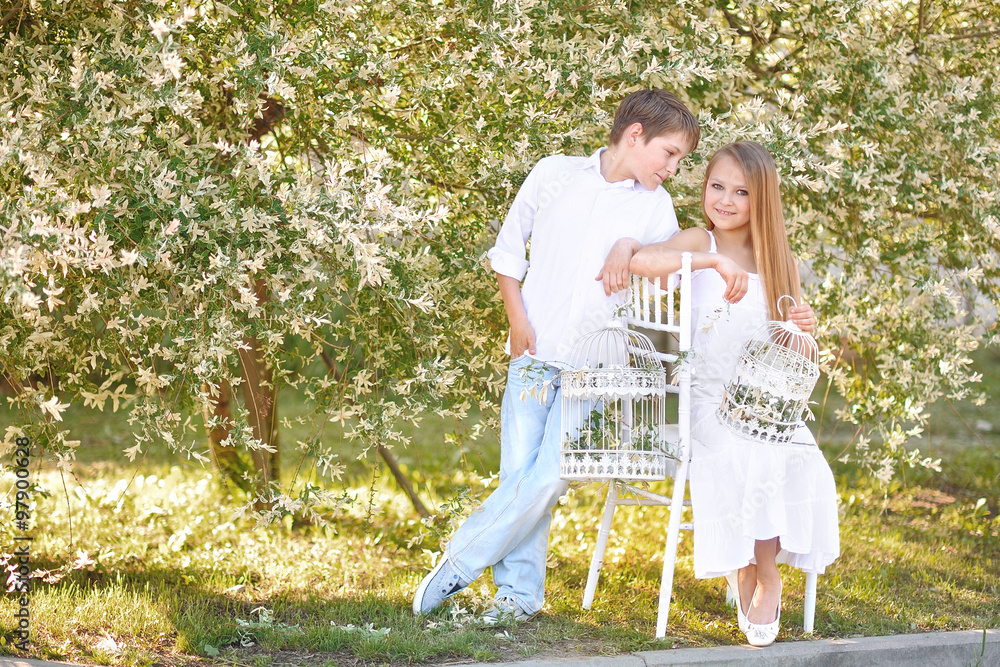 Fototapeta premium Portrait of a boy and girl in summer