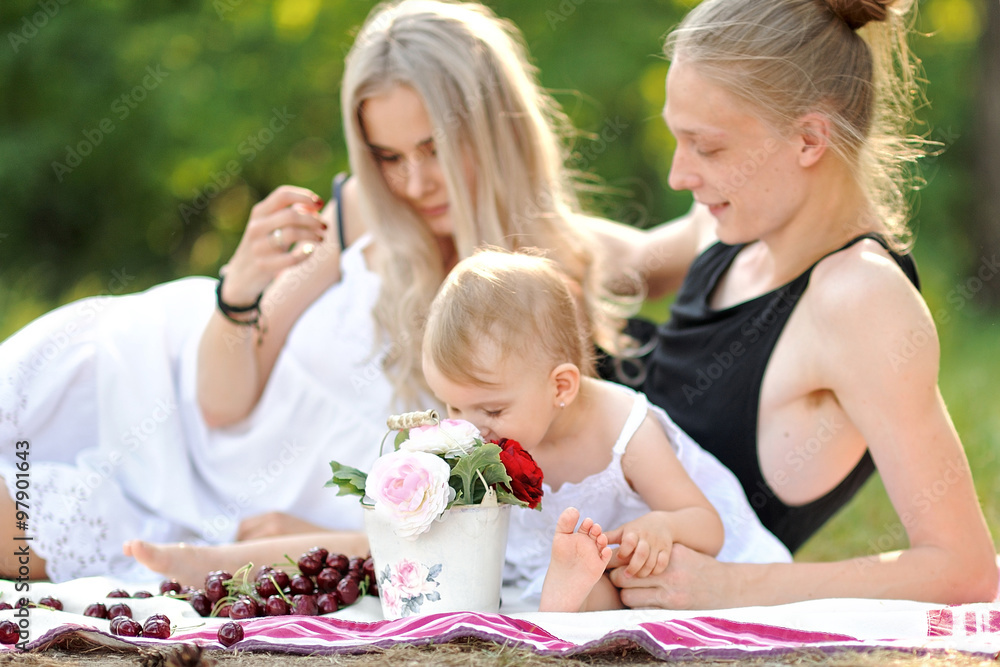 portrait of a happy family in the summer on the nature portrait of a happy family in the summer on the nature