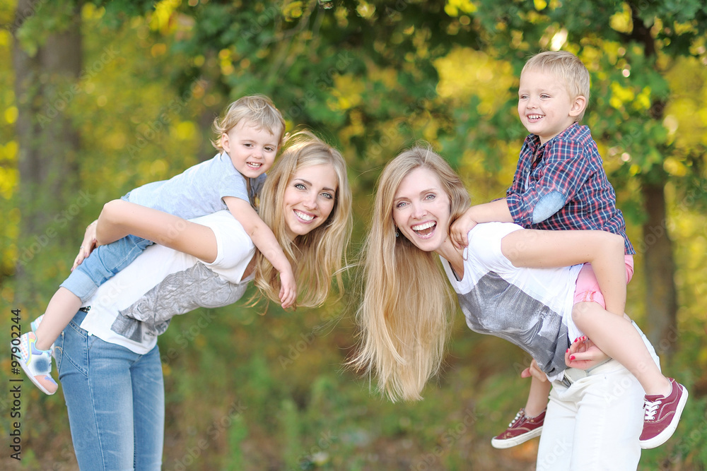 Fototapeta premium portrait of a happy family in the summer on the nature