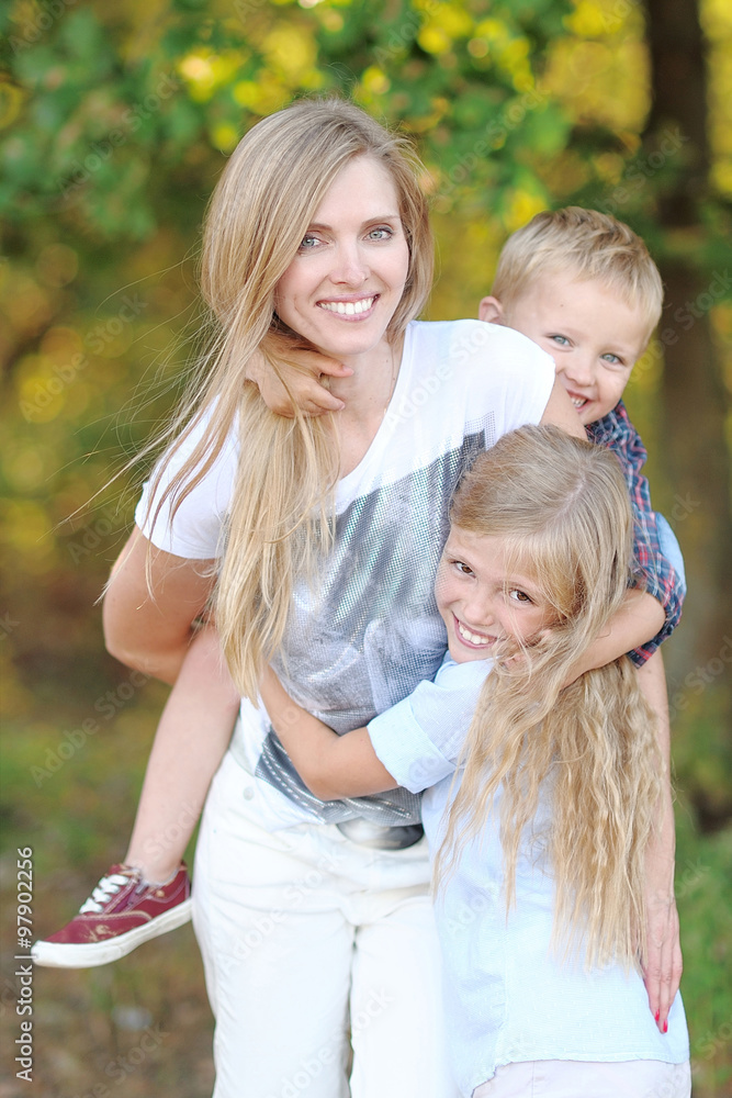 Fototapeta premium portrait of a happy family in the summer on the nature